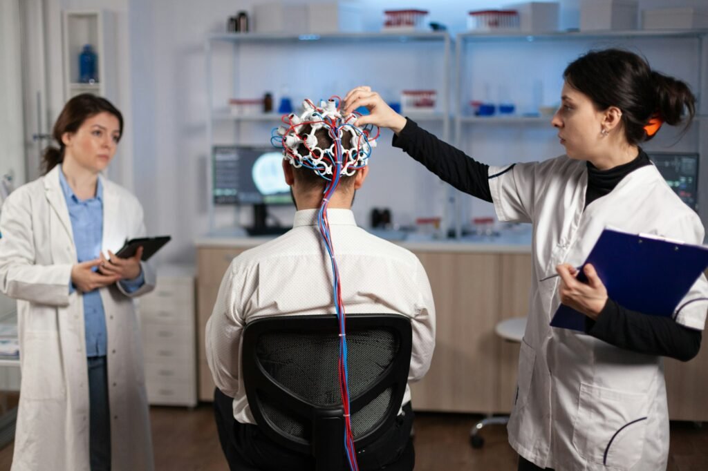 Medical team of neurologists adjusting brain eeg analyzing nervous system evolution