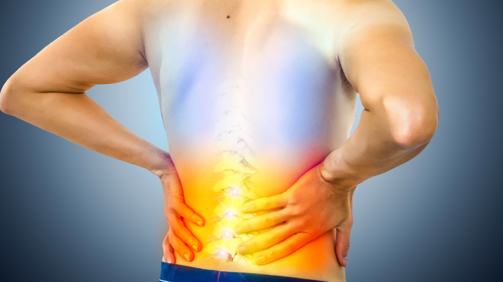 Chronic back pain treatment in panchkula | dr. Anurag lamba 2 Indian man experiencing lower back pain at a clinic in panchkula