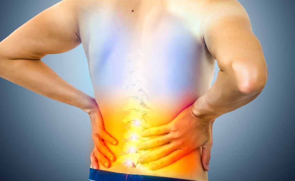 Indian man experiencing lower back pain at a clinic in Panchkula